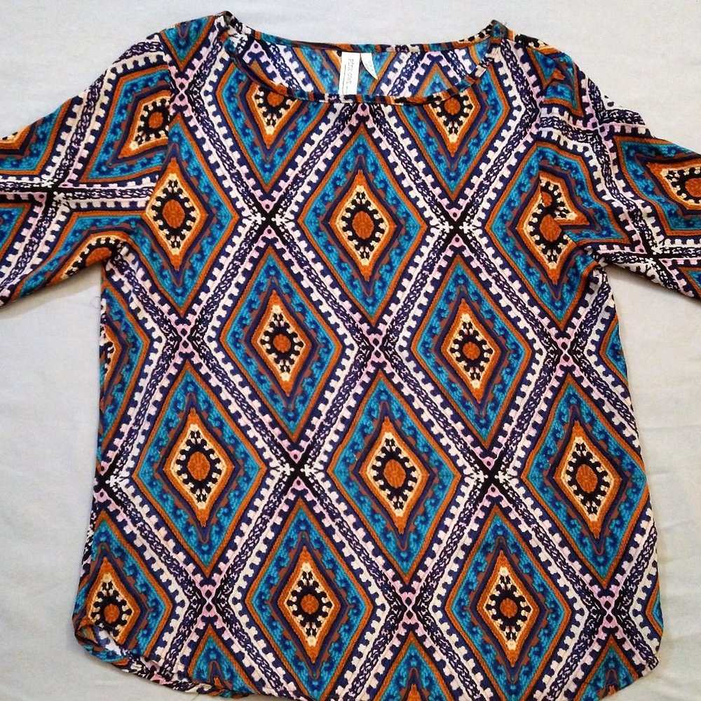 Brightly colored patterned blouse